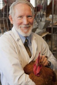 Mark Cook holding a chicken