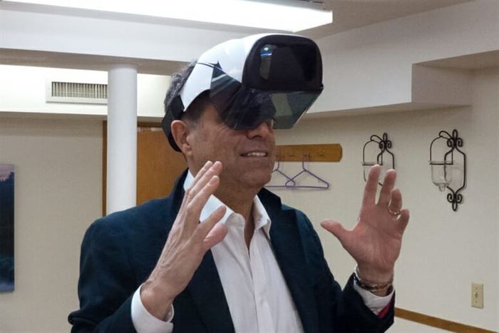 Bruce Winkler wearing a virtual reality headset