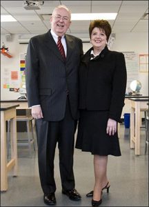 John W. and Jeanne M. Rowe standing in a classroom