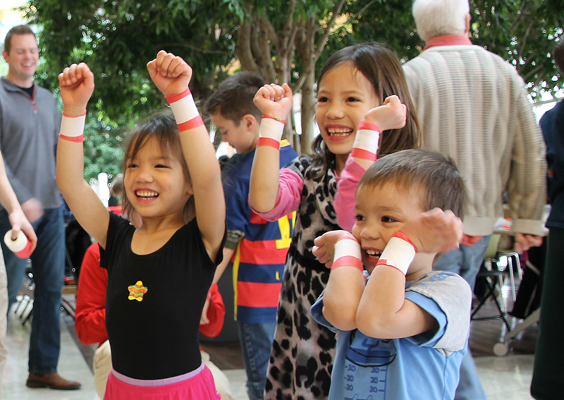 Children putting their hands in the air