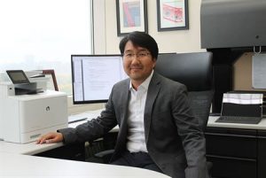 Seungpyo Hong sitting at a desk