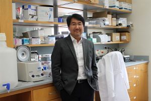Seungpyo Hong standing in a lab
