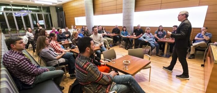 People attending a lecture at the Wisconsin Science Festival in 2016 in the Discovery building