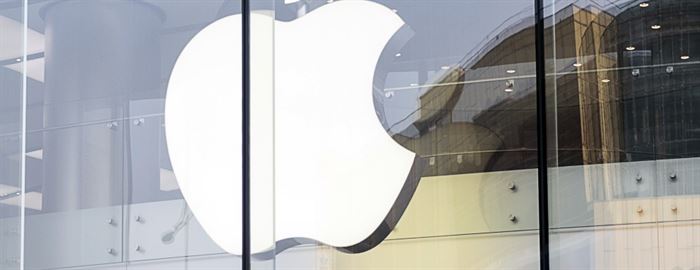 Photo of the front of an Apple store, with Apple logo visible