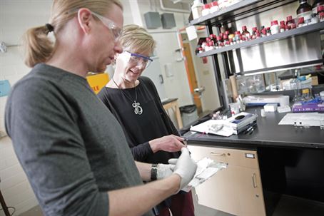 Dave Lynn and assistant working in a lab