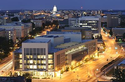 An aerial shot of the Discovery Building at dusk