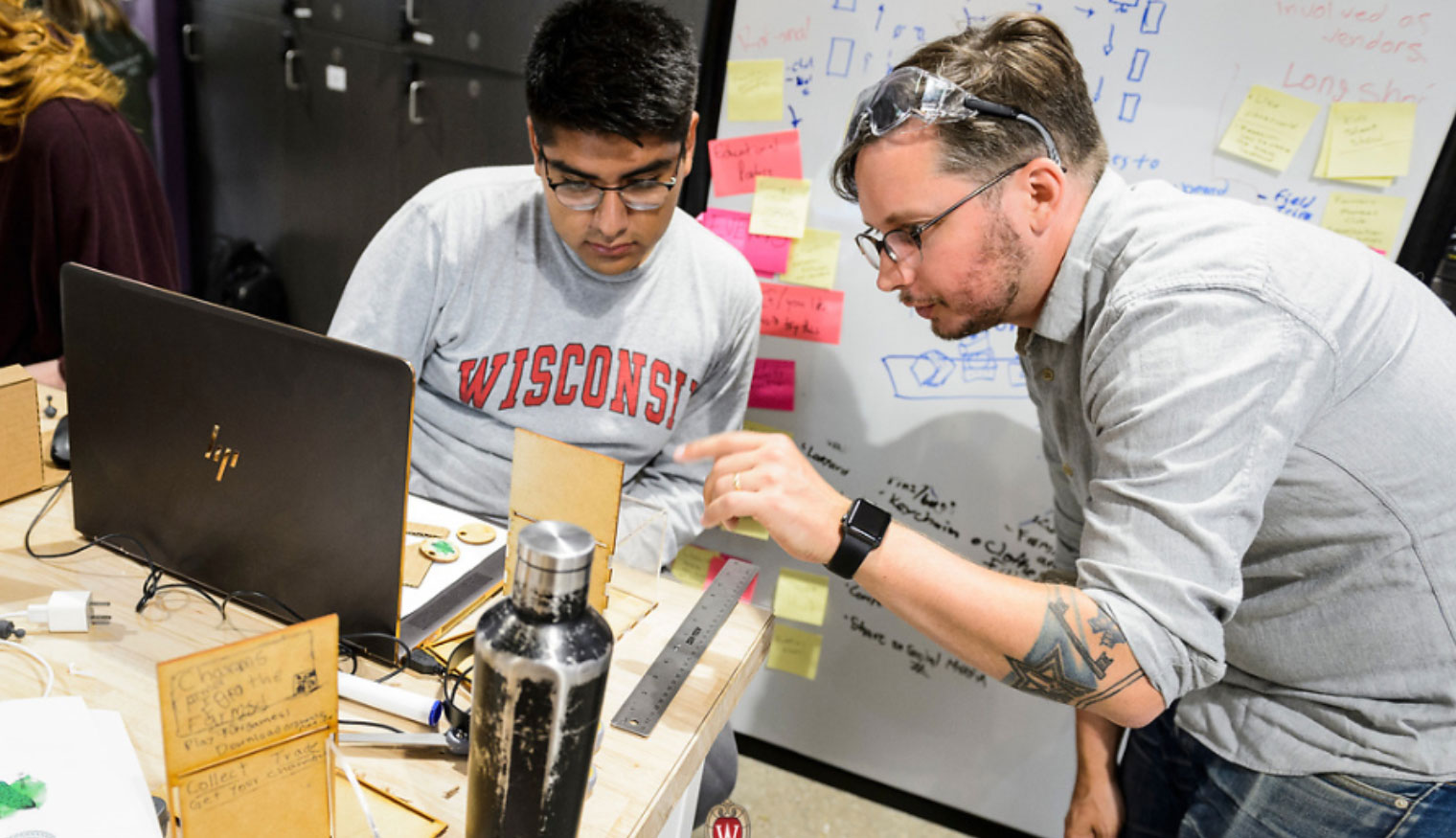 Students looking at a computer