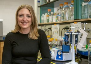 Liz Appelt in front of a lab bench